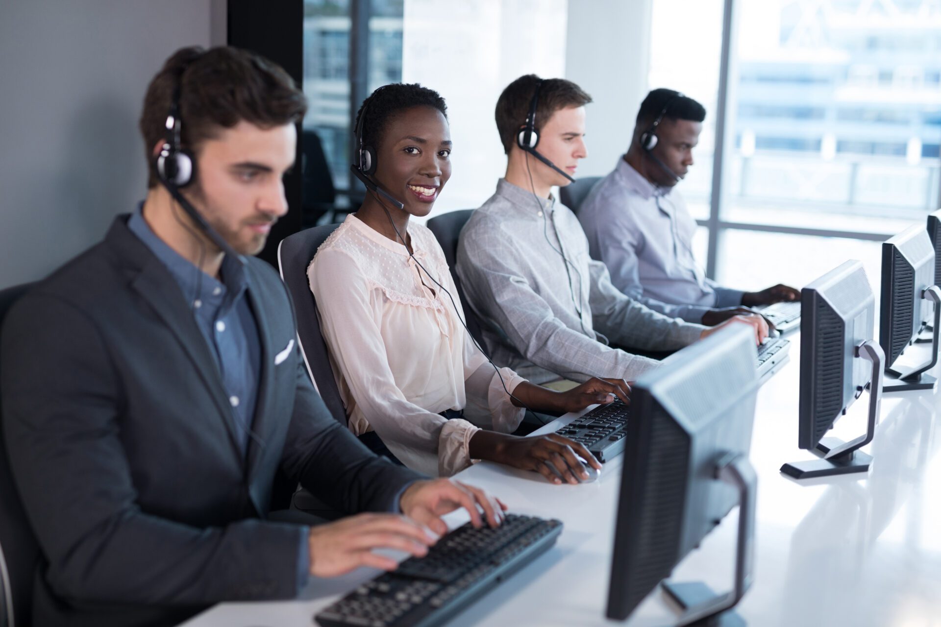 Portrait of customer service executives working at office